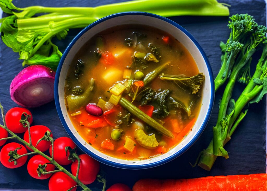 A bowl of chunky vegetable soup.