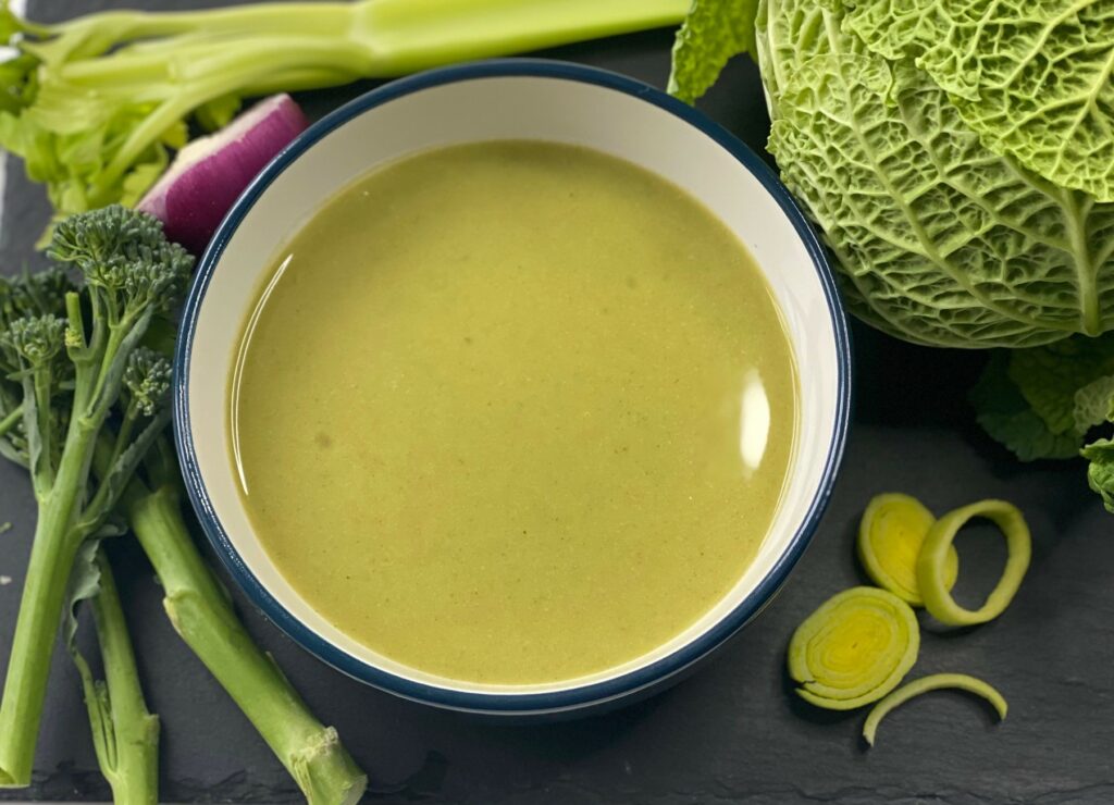A bowl of green soup.