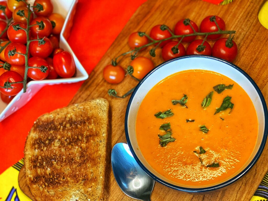 A bowl of tomato and red pepper soup.