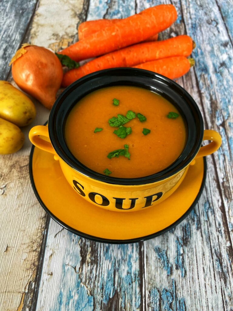 A bowl of carrot and coriander soup.