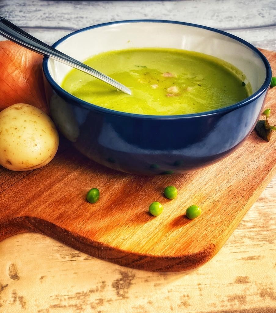 A bowl of pea and ham soup.